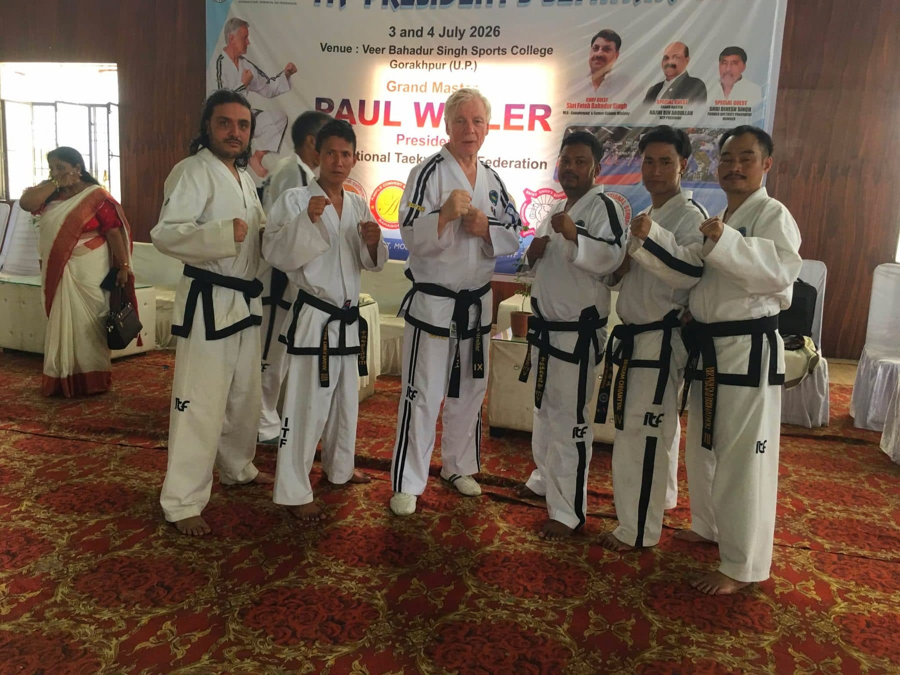 The Nepali delegation in guarding stance beside Grand Master Paul Weiler