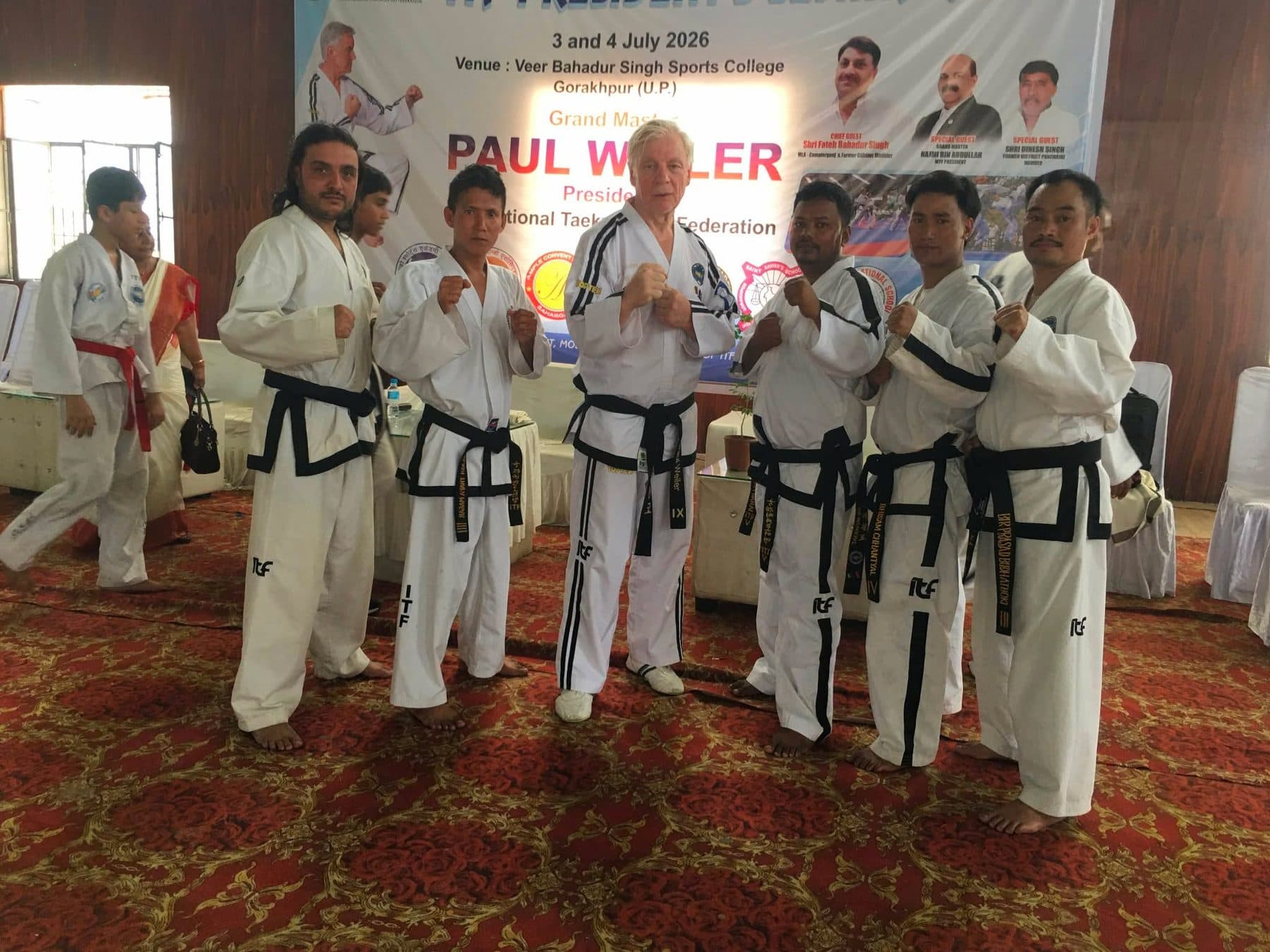 Nepali instructors with Grand Master Paul Weiler beneath the seminar banner